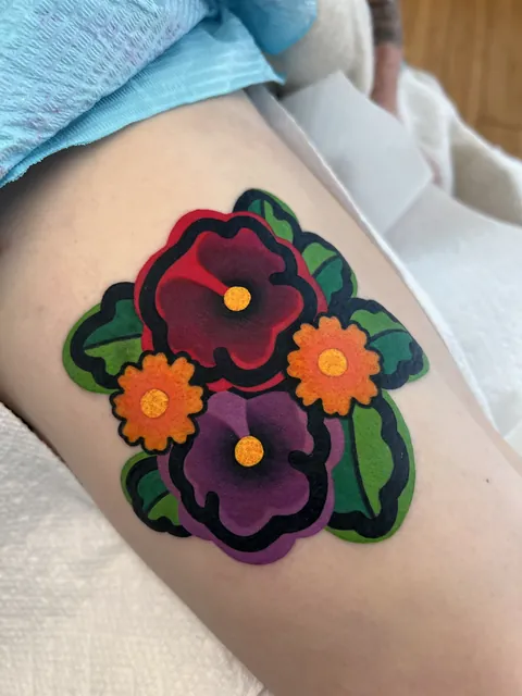 ACNH-inspired floral thigh piece by Mariah Baker - Lovebird Tattoo, Ozark, MO