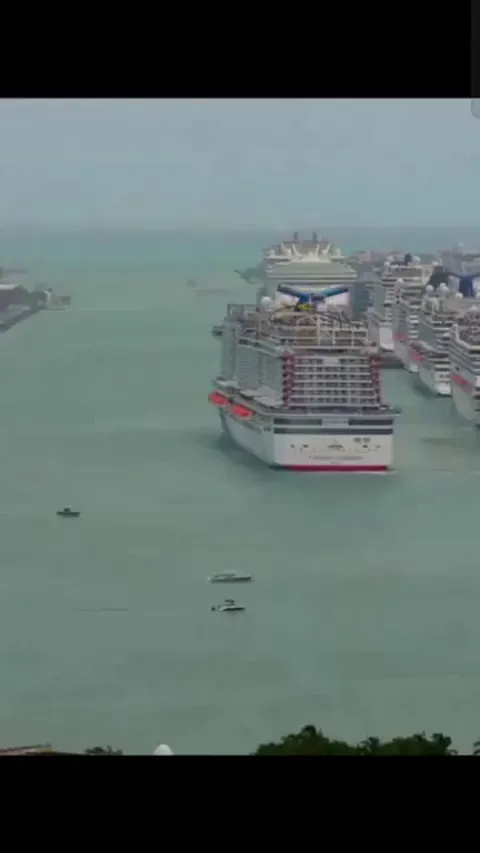 Cruise ships maneuvering out of port