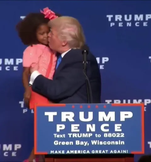 Former President Trump tries to kiss child on the lips