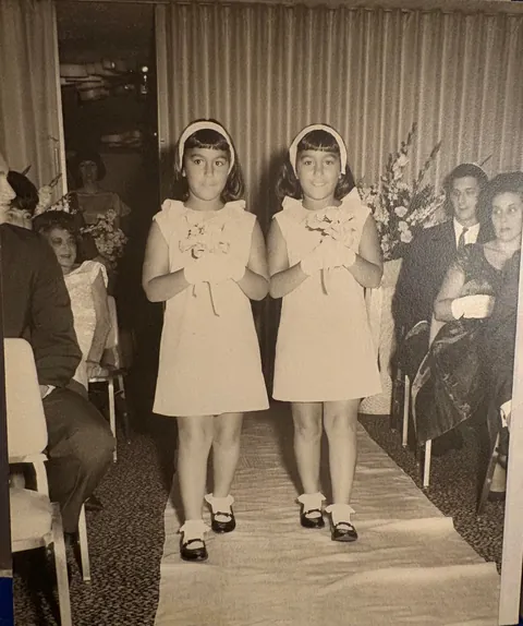 1964. My mom was a terrified girl from Brooklyn marrying into rich Chicago family. Bonus: twin flower girls!