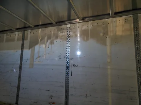 There was a small hole in the side of a trailer I was loading today, resulting in an image of the street outside being projected upside down on the opposite wall