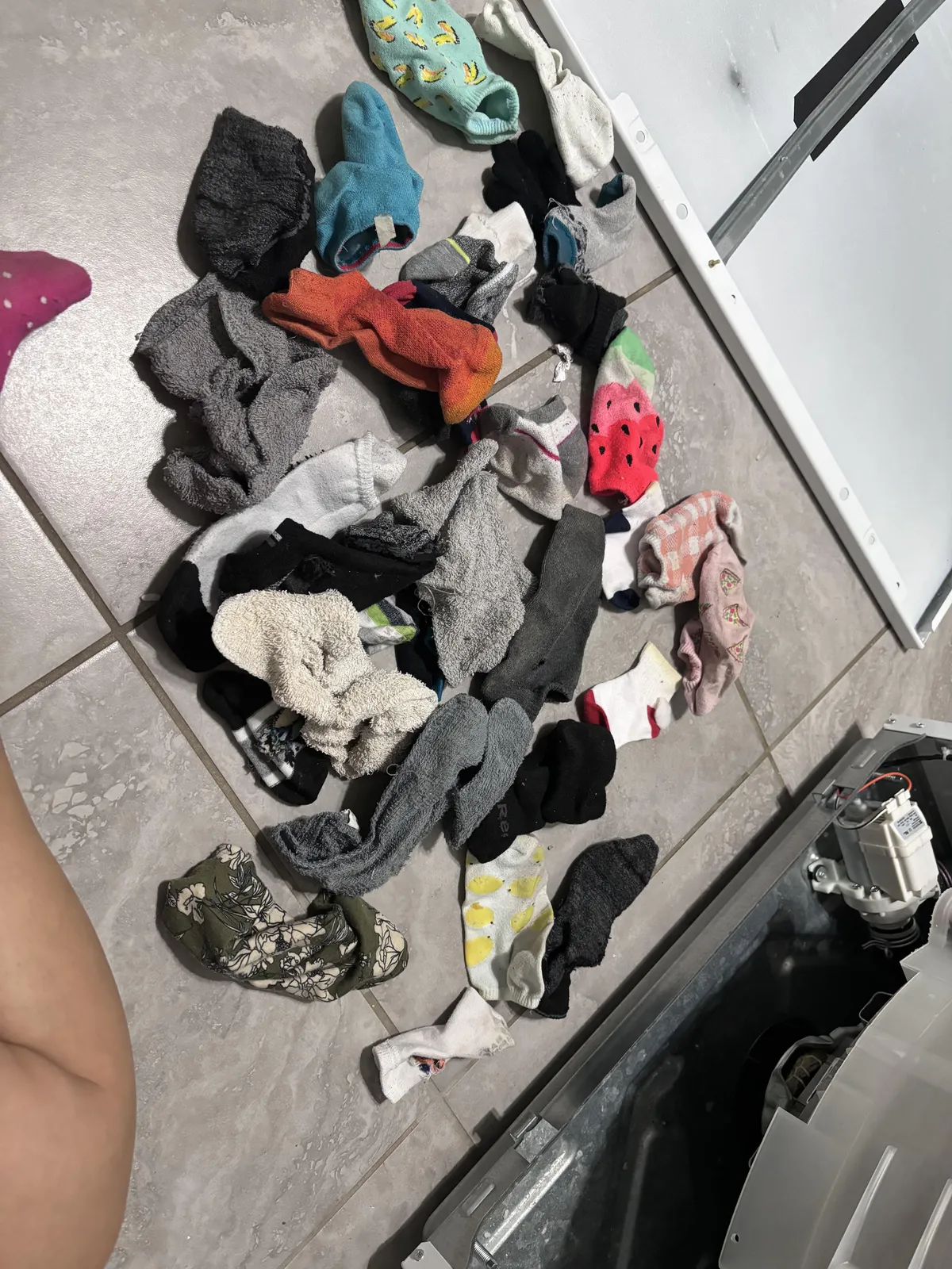 Removed the front panel to the washer and found 30+ pieces of missing clothing 