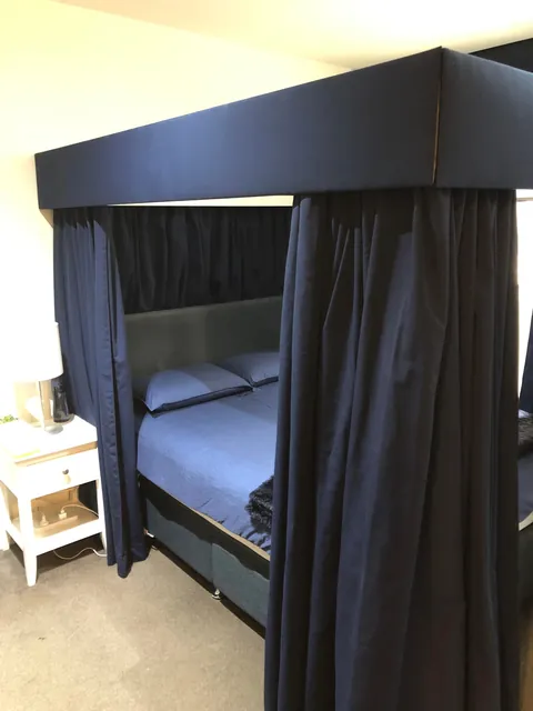 My new four-poster bed with curtains that actually close.