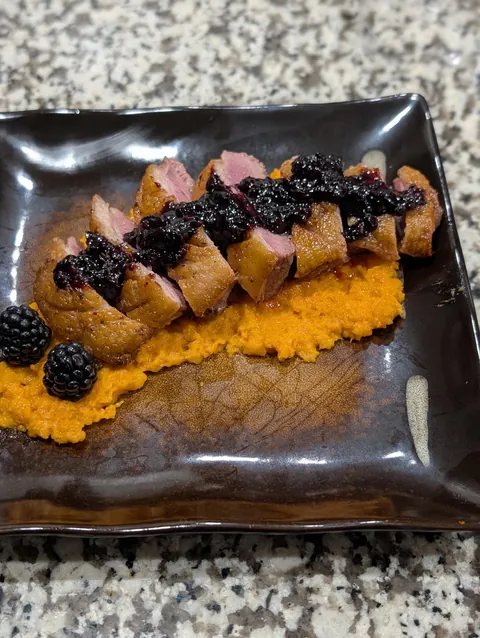 Pan-Seared Duck breast with blackberry sauce