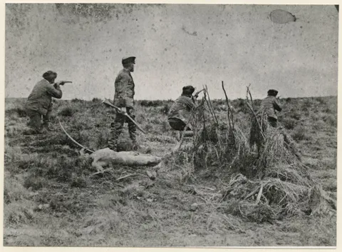 Julius Popper during one of his "Indian hunts" as part of his genocide against the natives. A naked murdered aboriginal lies at Popper's feet. Argentina, 1886