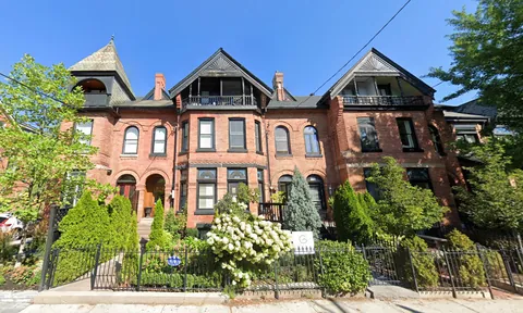  Beautiful red stone houses in toronto with wild green front gardens. 