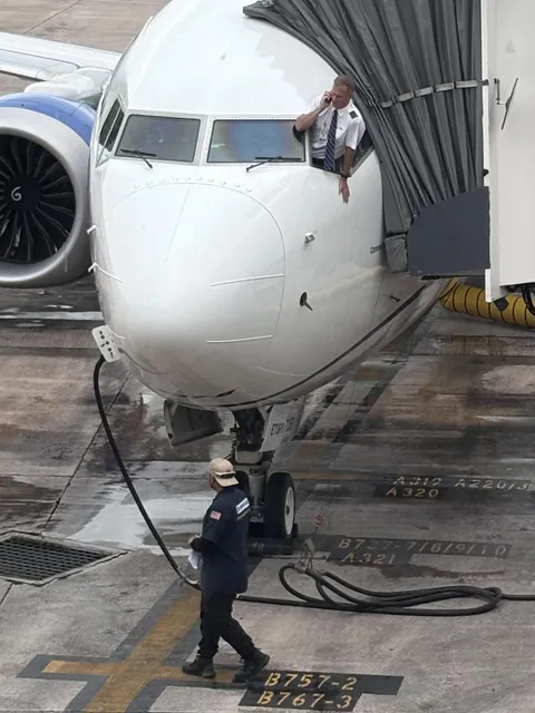 Pilot climbed outside the cockpit window to make a phone call