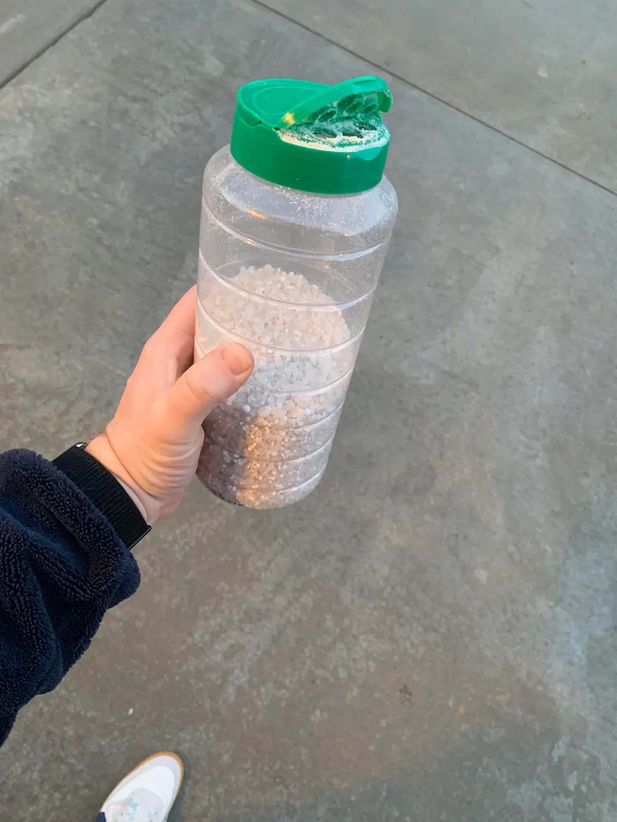 A left over parmesan cheese can makes a handy spreader for de-icer salt.
