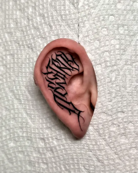 Ear lettering tattoo done by Edisson Tattoos in Toronto,Canada