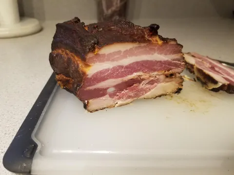 Homemade Apple wood smoked bacon. Did everything myself, including killing the hog