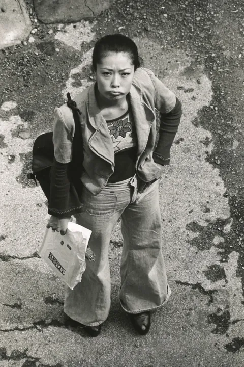 In 1974, Masahisa Fukase photographed his wife, Yōko Wanibe, every morning from the window of their apartment in Tokyo as she left for work.