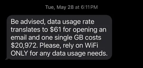 A text my buddy got from his phone company when traveling abroad. Reminds me of Russia trying to fine Google. 