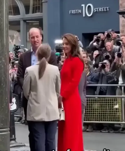 Man accidentally strolls past Prince William and Princess Kate in London