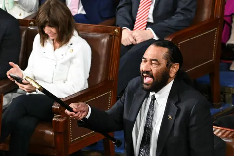 Rep. Al Green protests during President Trump's joint address to Congress before being escorted out