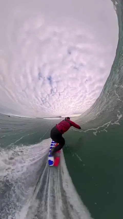 Surfer Locked Inside a Perfect Barrel Wave.