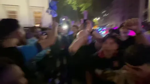 Napoli fans in London celebrating the title with Sunderland fans