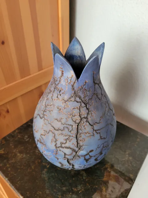 When we bought our house we cut down a large gnarly holly tree. My new neighbor, a woodturner, asked me for the wood in exchange for something cool he would make from some of it. Here is that holly vase with Lichtenberg patterns.