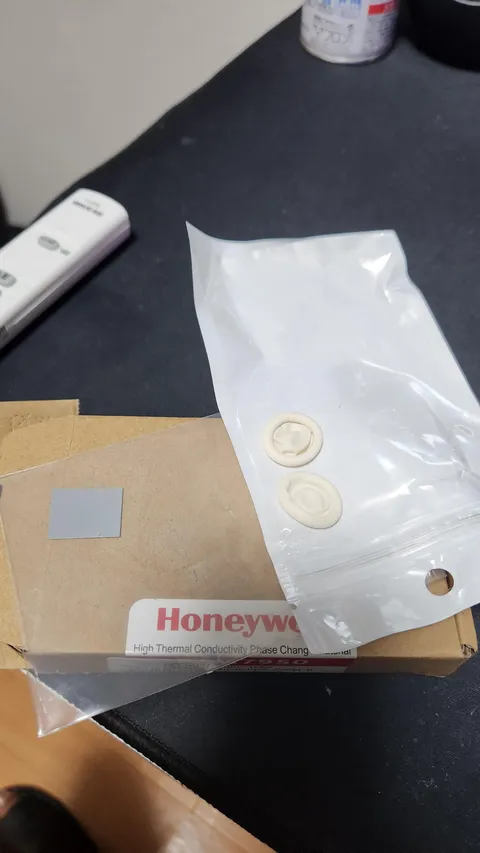 I ordered some Honeywell PTM7950 to replace the thermal pad in my laptop, and it came along with these white mushroom looking thing. What are these? 