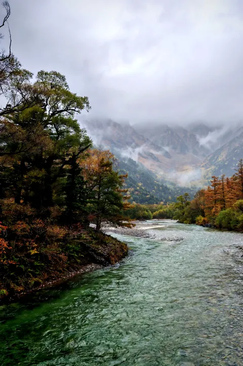 Autumn mist over the Azusa river, Japanese Alps. [OC] [2726x4095]