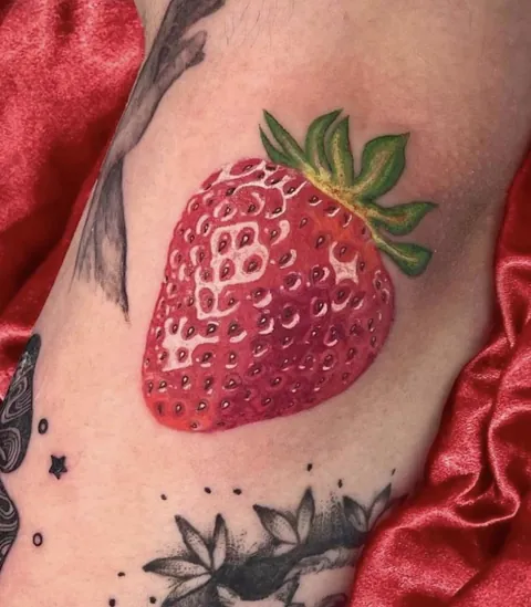 KVMCQtattoos from Yonge Street Tattoo in Toronto, Photorealistic Strawberry tattoo.