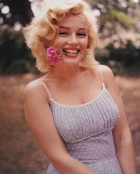 Marilyn Monroe and her husband Arthur Miller were photographed at their home in Amagansett,1957