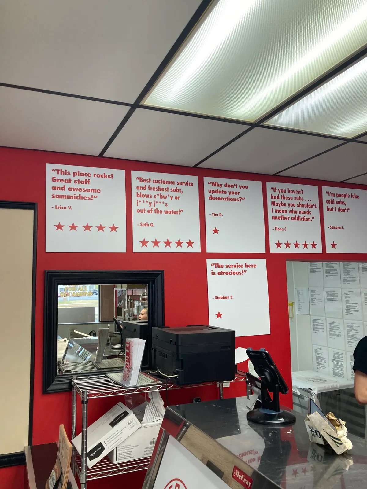 This sandwich shop displays their one star reviews.