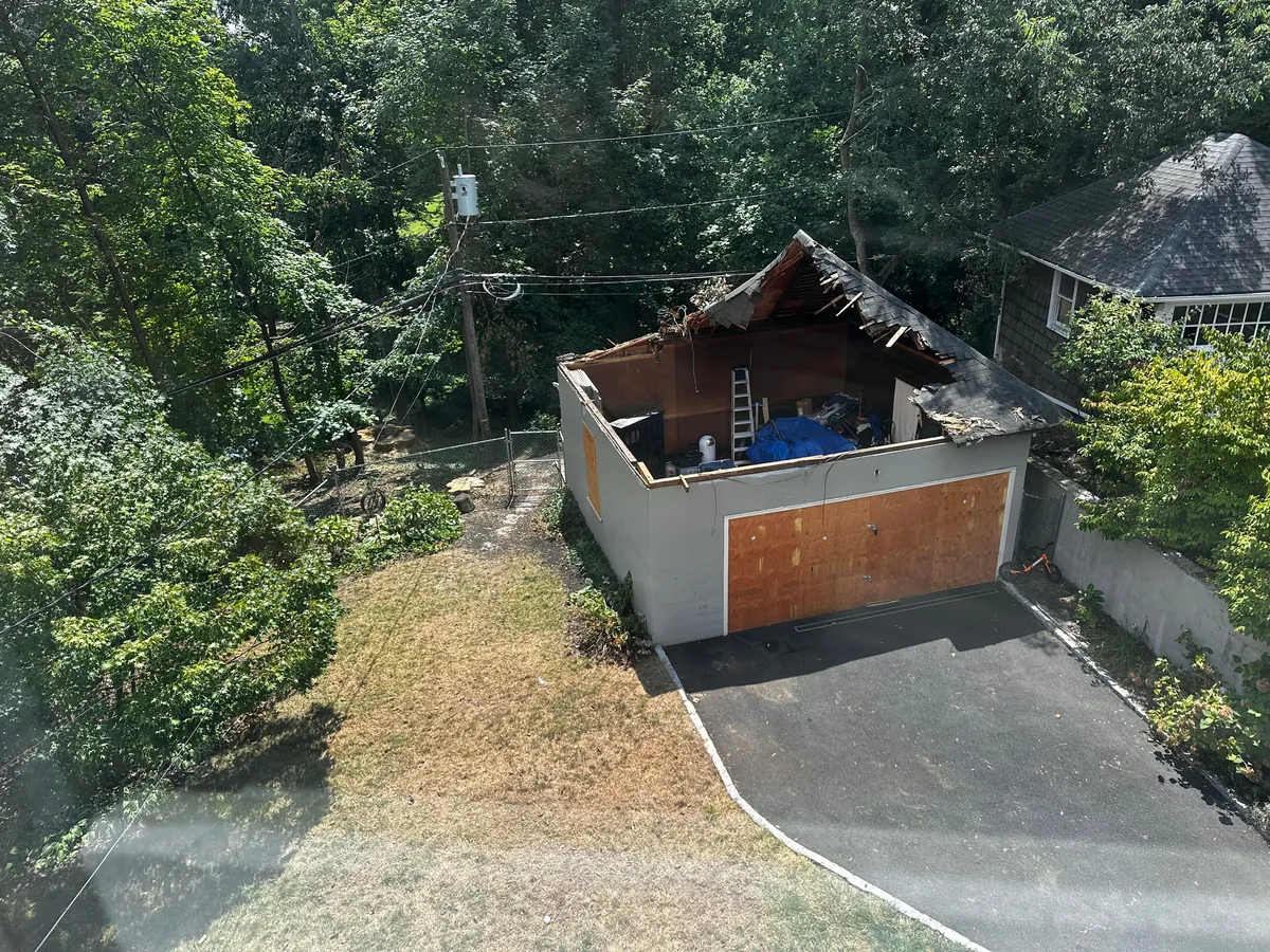 Before and after neighbor’s tree fell on our garage.