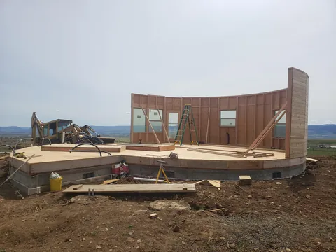 Spent several years building a complete 1300 sq ft roundhouse from top to bottom with my wife, including all framing, electrical, plumbing, HVAC, etc. By far the worst idea we've ever had, and so happy to be in it finally.