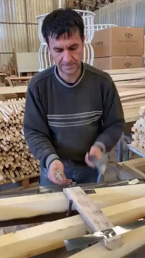 Carpenter hammering nails in a smooth rhythm