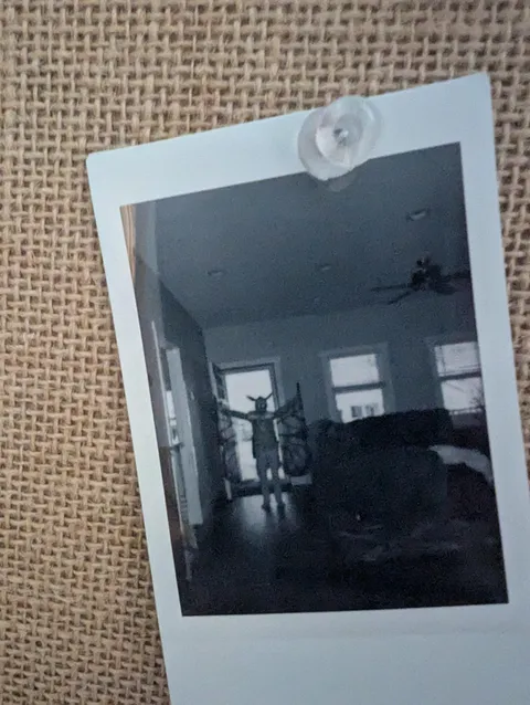 My daughter is 9 and has this creepy photo on her wall that she refuses to explain.