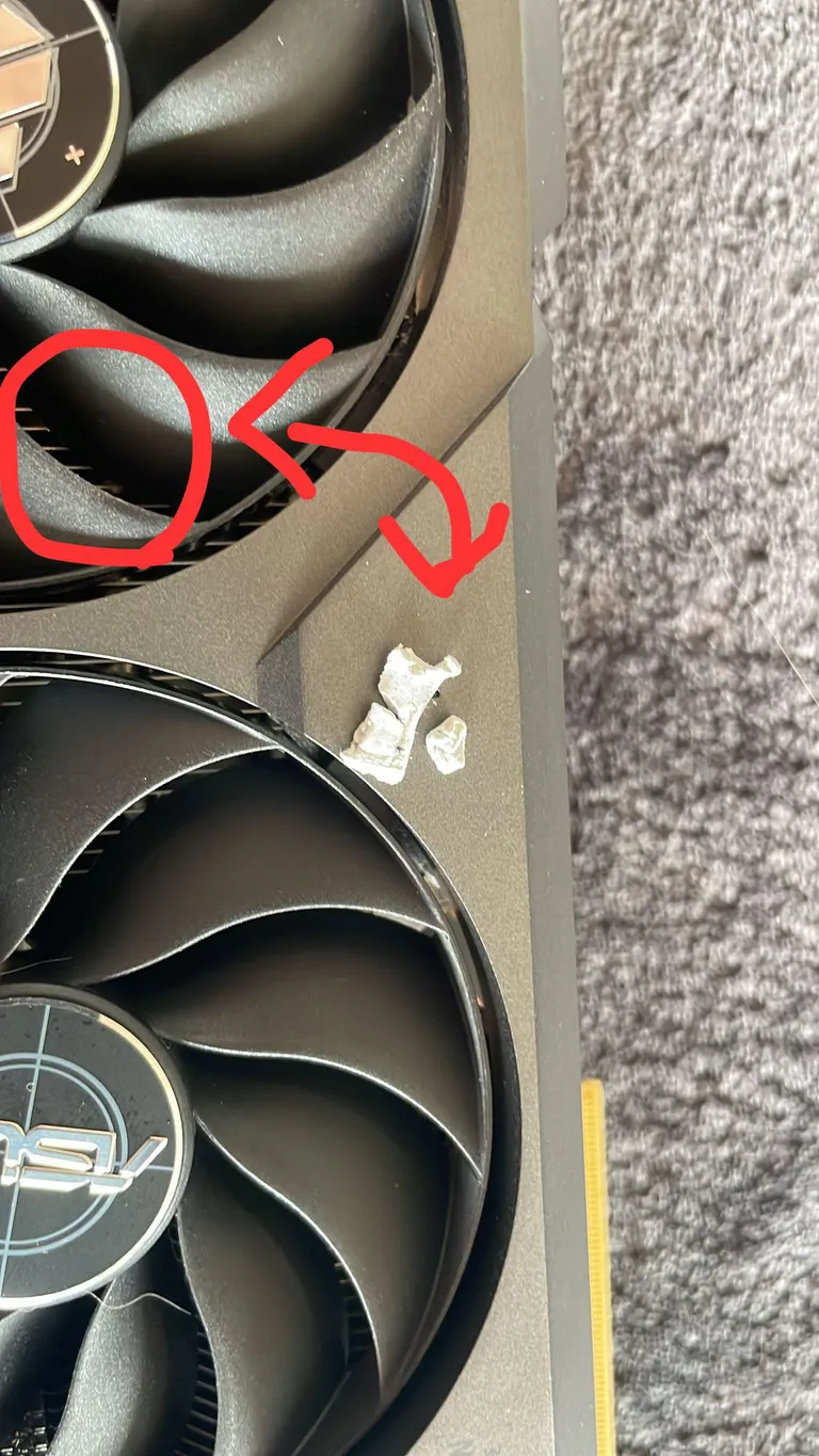 What is this that I found in my graphic card fan? Is it correlated to my pc smelling like burnt while playing?