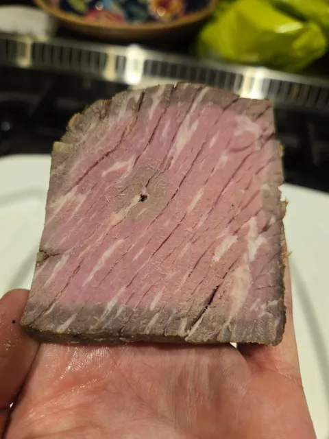 My Christmas Roast cooked from the inside where the metal thermometer probe was inserted