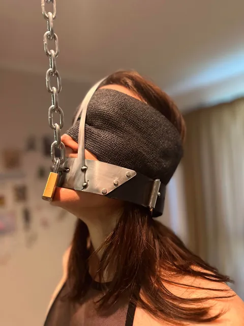 Dressed up like a good little slut, locked in chastity, made to wear a scolds’s bridle with spikes and strung up like a piece of meat.