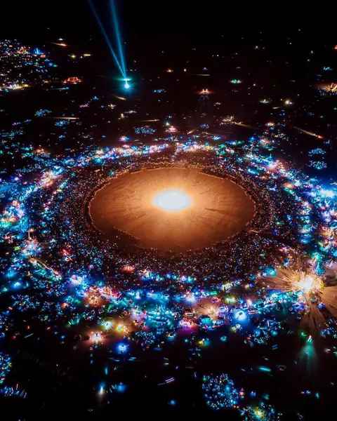 A photo of burning man that looks like a solar system