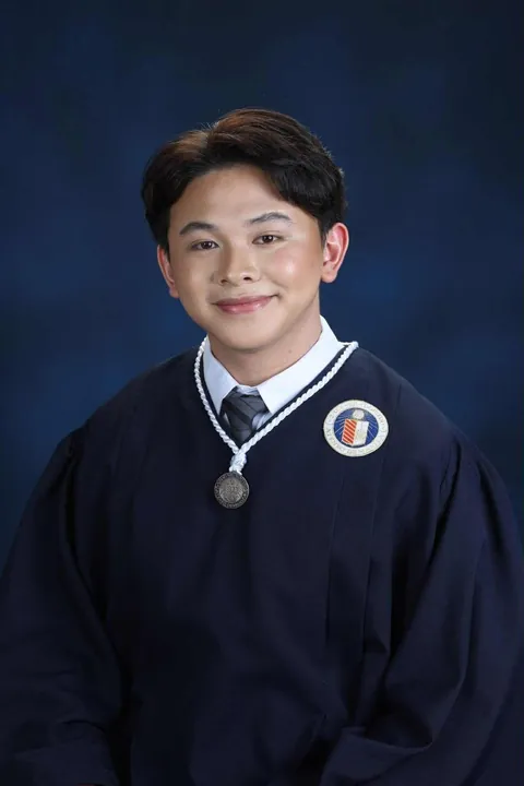 Kicked out for being gay, former street child graduates from Ateneo