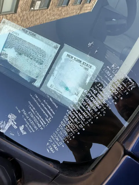 These people put a menu on my car, then it rained. It was so difficult to peel this off my window shield.