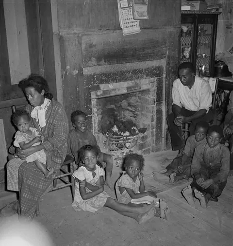 Coal miner with six of his seven children. West Virginia, 1938.