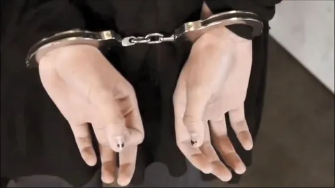 Some palms out handcuffs