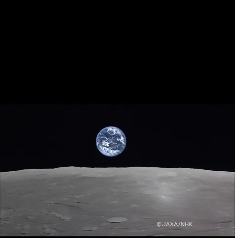 Real footage of Earth rising over the Moon captured by the Japanese lunar orbiter.