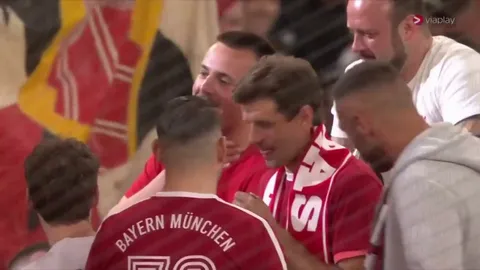 Thomas Müller leading the Südkurve in song after his last home game