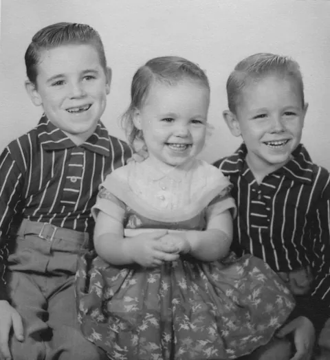 My mom's annual Christmas cards included a portrait of my big brothers and me. 1953-1959