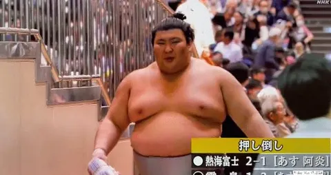 Sumo wrestler happy with his winnings 