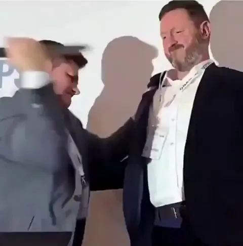 Body armor company demonstrates its protection product on its CEO