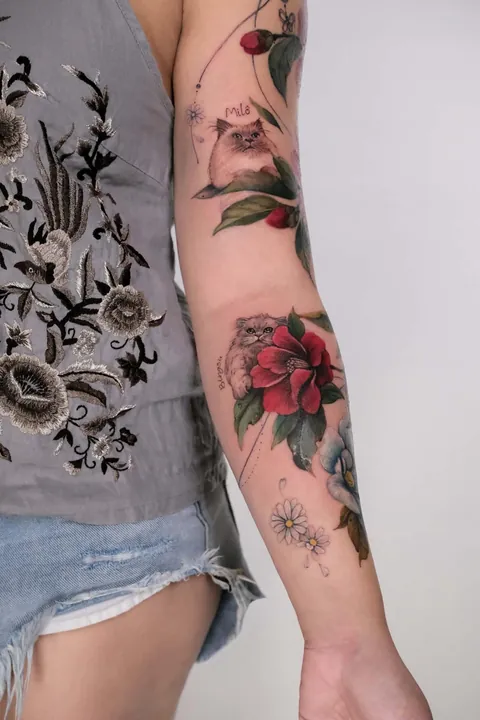 My fur babies hiding amongst our first home’s 50yo camellia tree