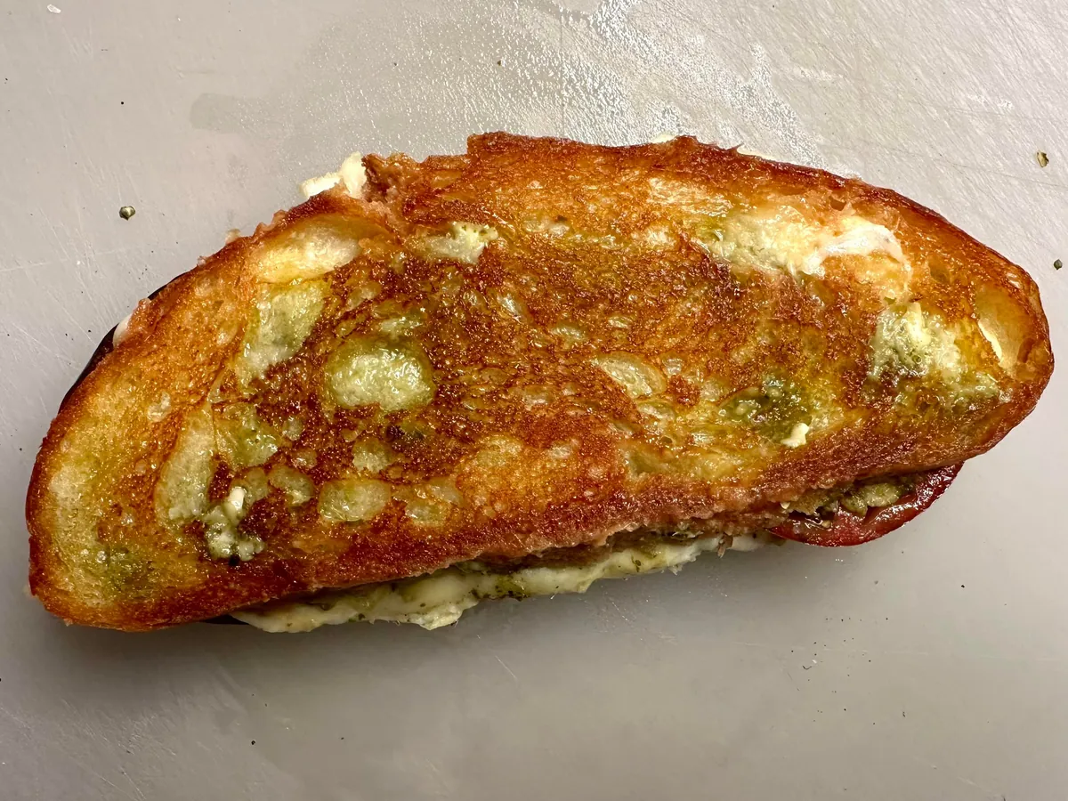Mozzarella, tomato, and pesto melt on [homemade] bread