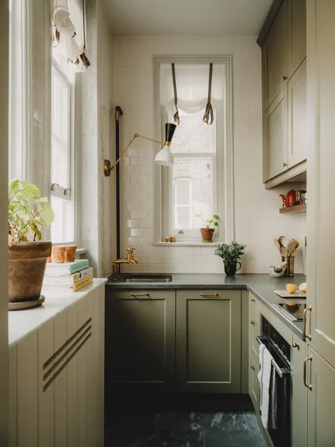Narow galley kitchen with many windows in a two bedroom flat in a Victorian mansion block, Battersea, London, UK [1875x2500]