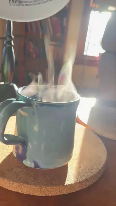 Rainbow prism effect due to light from window and steam from hot coffee [OC]