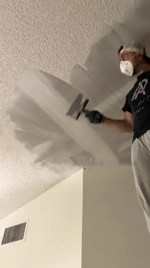 Removing that terrible popcorn ceiling at last. Lovely on many levels
