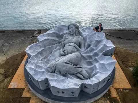 "Ocean Gaia", Japan's first underwater sculpture, weighing over 45 tons and 5.5 meters wide, created by British sculptor Jason deCaires Taylor, featuring Japanese model Kiko Mizuhara, resting 5 meters below the surface off the island of Tokunoshima, Japan, installed on October 14, 2025