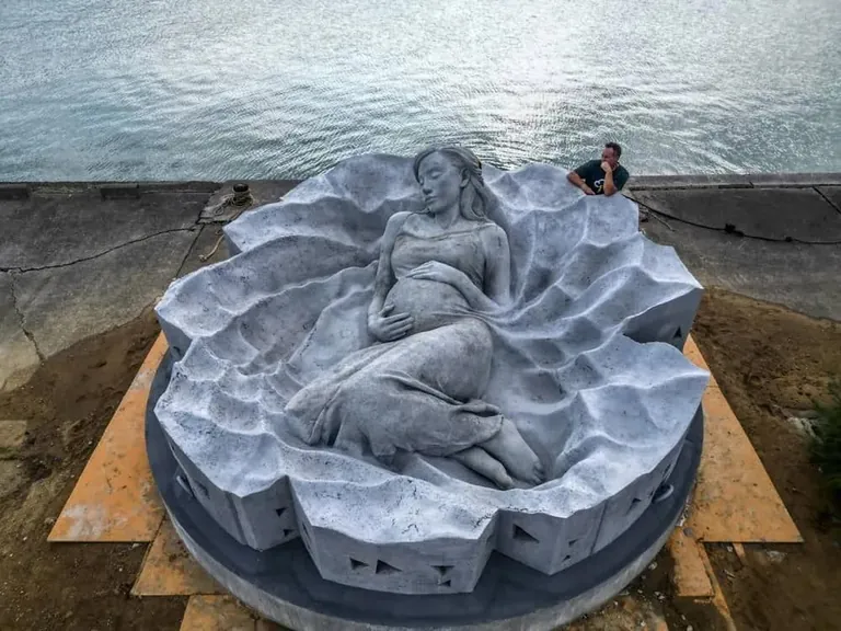 "Ocean Gaia", Japan's first underwater sculpture, weighing over 45 tons and 5.5 meters wide, created by British sculptor Jason deCaires Taylor, featuring Japanese model Kiko Mizuhara, resting 5 meters below the surface off the island of Tokunoshima, Japan, installed on October 14, 2025